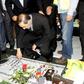 Ali Akbar Velayati, who has been slapped with sanctions by the United States and serves an adviser to Iran's supreme leader Ayatollah Ali Khamenei, prays over the tomb of a Hezbollah fighter at a cemetery in Beirut's southern suburbs in May 2015