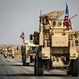 Dozens of US armoured vehicles escorted by helicopters were seen driving through northern Syria
