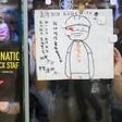 Protesters stuck posters outside a shopping mall in an August rally to support Cathay Pacific staff in Hong Kong