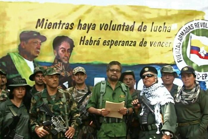 Former senior commander Ivan Marquez (center) and fugitive rebel colleague Jesus Santrich (in sunglasses), of the dissolved FARC rebel army group in Colombia, announced that they are taking up arms again along with other guerrillas