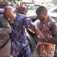 Dino Melaye being assisted into the courtroom by his aides. (KayodeOgundamisi/Twiitter)