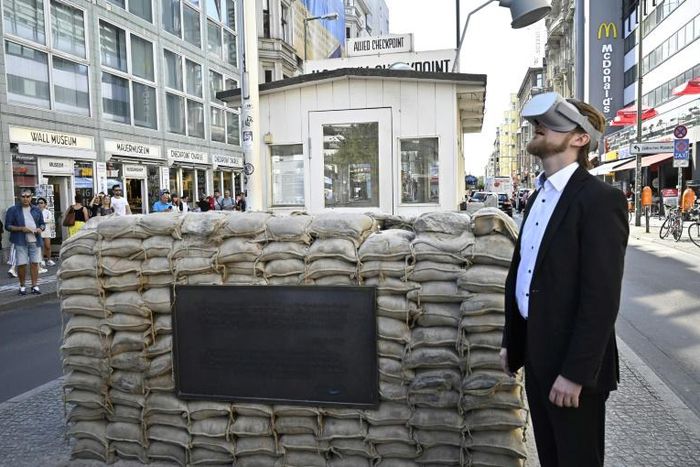 Jonas Rothe, pictured at Checkpoint Charlie, says his virtual reality tours tap into a desire for "authentic", interactive and immersive historical tourism