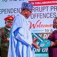 President Muhammadu Buhari honours Mrs Josephine Ugwu, a former cleaner at the Murtala Muhammed International Airport (MMIA), Lagos, who found and returned millions of naira forgotten in the toilet by airport users.[Twitter/@BashirAhmaad]