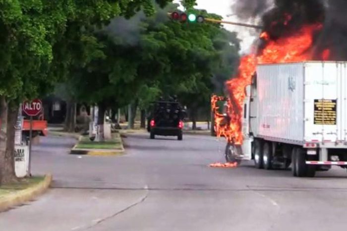 Trucks burn in Culiacan, capital of jailed Mexican druglord Joaquin "El Chapo" Guzman's home state of Sinaloa, on October 17, 2019