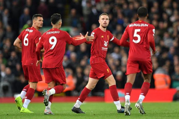 Liverpool celebrate their equaliser against Tottenham at Anfield