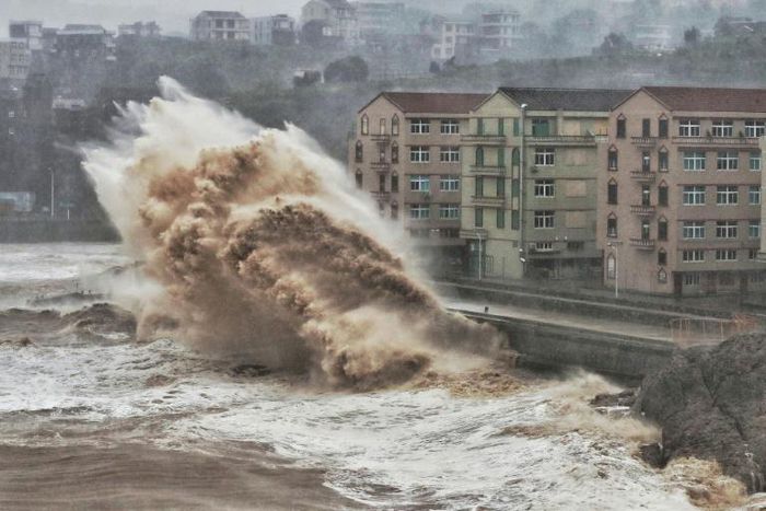 Waves hit a sea wall in Taizhou in China's eastern Zhejiang province, battered by Super Typhoon Lekima