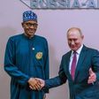 President Buhari shakes President Putin during the Russia-Africa summit (Channels TV)