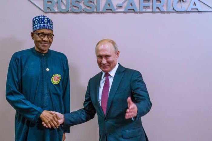 President Buhari shakes President Putin during the Russia-Africa summit (Channels TV)
