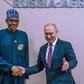 President Buhari shakes President Putin during the Russia-Africa summit (Channels TV)