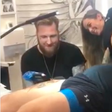 The Mountain Bench Presses Wife in Tattoo Studio