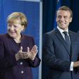 New ECB head Christine Lagarde (right) wants Germany Chancellor Angela Merkel (left) to increase public spending to give the sluggish European economy a boost, a move supported by French President Emmanuel Macon (centre)
