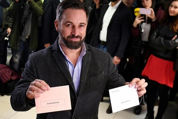 Vox's far-right candidate Santiago Abascal poses with his ballots in Madrid as his party looks for a surge in support