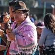 A sharp rise in fuel prices has sent thousands of indigenous, like this woman, into the streets of Ecuador's capitol