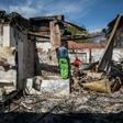 Aftermath: People rummage through looted foreign-owned shops in Malvern, a Johannesburg suburb
