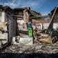 Aftermath: People rummage through looted foreign-owned shops in Malvern, a Johannesburg suburb