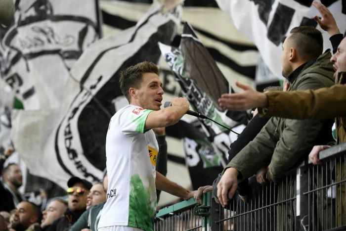 Moenchengladbach's double hero Patrick Herrmann celebrates with fans