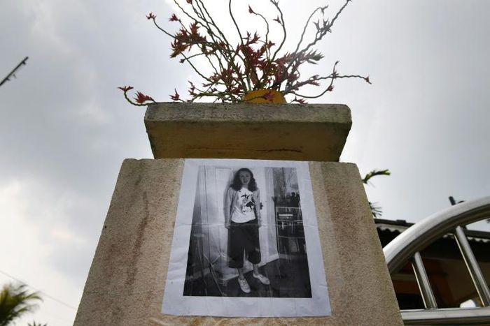 A poster showing missing Franco-Irish teenager Nora Quoirin is displayed outside a school in Seremban in Malaysia