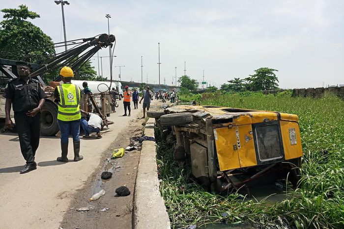 The commercial vehicle that fell into canal in front of National Arts Theatre, Iganmu, Lagos on Monday (NAN)