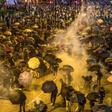 The US Congress has antagonized Beijing by passing legislation that supports human rights and democracy in Hong Kong, where months of protests and unrest have rocked the semi-autonomous Chinese territory
Protesters react as police fire tear gas while t...