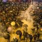 The US Congress has antagonized Beijing by passing legislation that supports human rights and democracy in Hong Kong, where months of protests and unrest have rocked the semi-autonomous Chinese territory
Protesters react as police fire tear gas while t...
