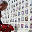 White House national security adviser John Bolton lays flowers at a memorial for those killed in Ukraine's war against Russia-backed separatists