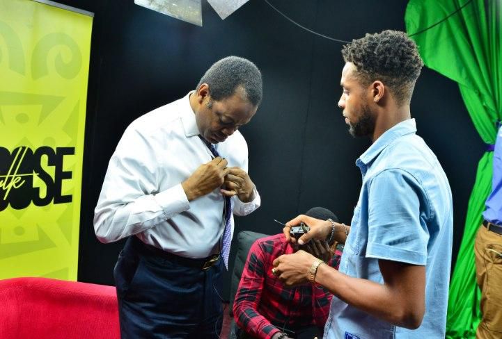 Donald Dukes latches his lapel mic before a chat with Pulse