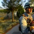 An Afghan soldier sits in the back of a vehicle on patrol in Guzara district in Herat province. The UN says there was an unprecedented number of civilian casualties between July and September 2019