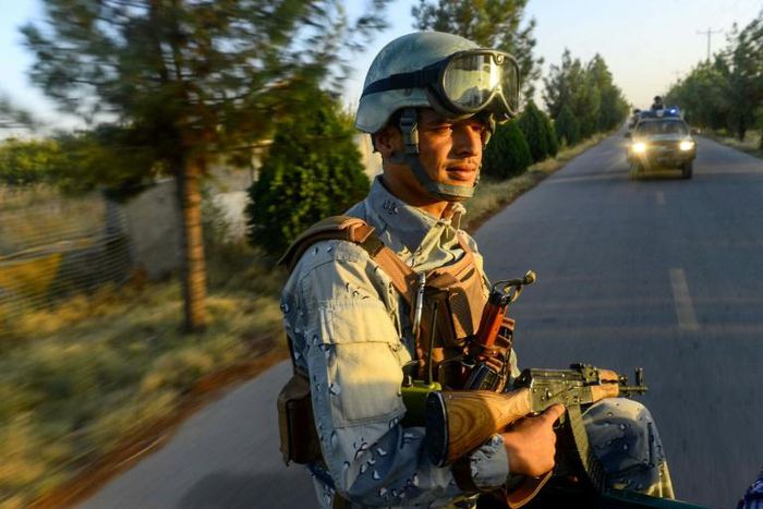 An Afghan soldier sits in the back of a vehicle on patrol in Guzara district in Herat province. The UN says there was an unprecedented number of civilian casualties between July and September 2019