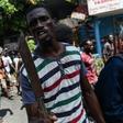 A demonstrator marches to demand the resignation of President Jovenel Moise, in Port-au-Prince, Haiti, on September 27, 2019