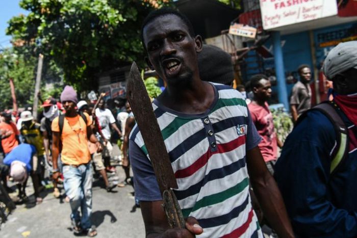 A demonstrator marches to demand the resignation of President Jovenel Moise, in Port-au-Prince, Haiti, on September 27, 2019