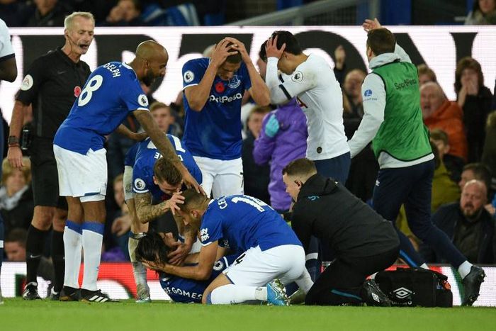 Everton's Andre Gomes (on the floor) has been released from hospital just two days after suffering a broken ankle