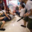 A Beijing supporter fights with an anti-government protester inside a shopping mall in Kowloon Bay.The Hong Kong protests have increasingly pitted ordinary people against each other
