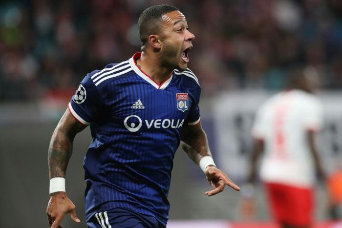 Memphis Depay celebrates scoring the opening goal at RB Leipzig on Wednesday