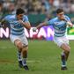 South Africa skipper Siya Kolisi (R) outpaces two Argentines during a Rugby World Cup warm-up match in Pretoria last month