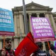Demonstrators against the government economic policies in front of the palace of the Courts in Santiago