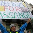 Around 50 gathered outside the court, chanting "free Julian Assange"