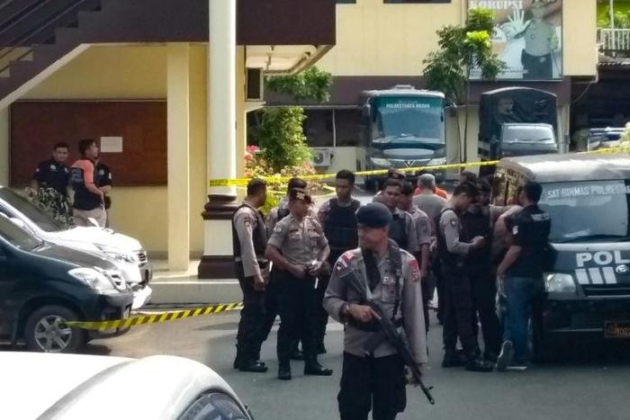 Indonesian police at their headquarters in Medan after the suspected suicide attack