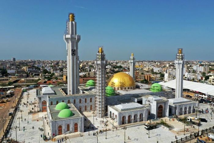 The huge Massalikul Mosque has risen from swampy land in the rundown district of Bopp
