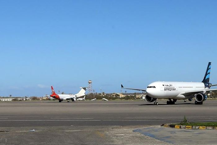 Grounded planes sit on the tarmac at Mitiga International Airport near the Libyan capital Tripoli