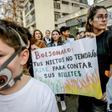 Marchers protest against Brazilian President Jair Bolsonaro over the fires in the Amazon rainforest in front of Brazil's embassy in Santiago, Chile August 23, 2019