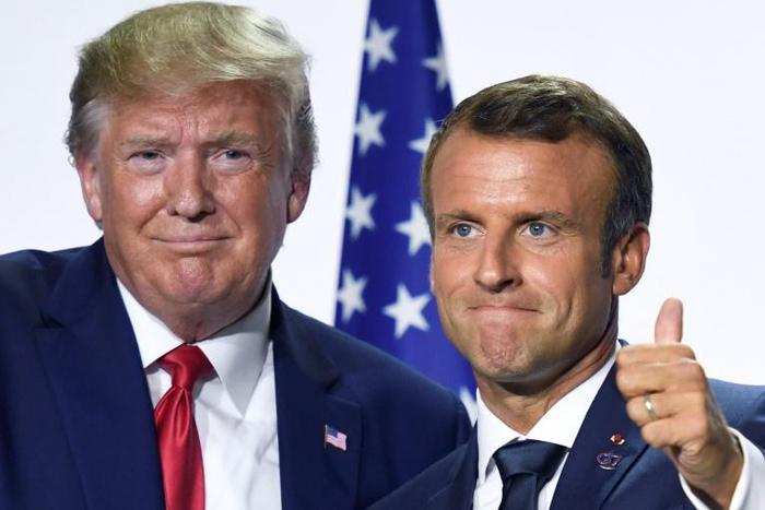 French President Emmanuel Macron and his US counterpart Donald Trump pose for pictures after meeting during the Group of Seven summit in Biarritz, France