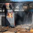 Attacked: The remains of a store in Johannesburg's Malvern area after a night of violence