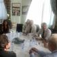 Mohammad Javad Zarif smiling broadly during talks with President Emmanuel Macron and other French officials