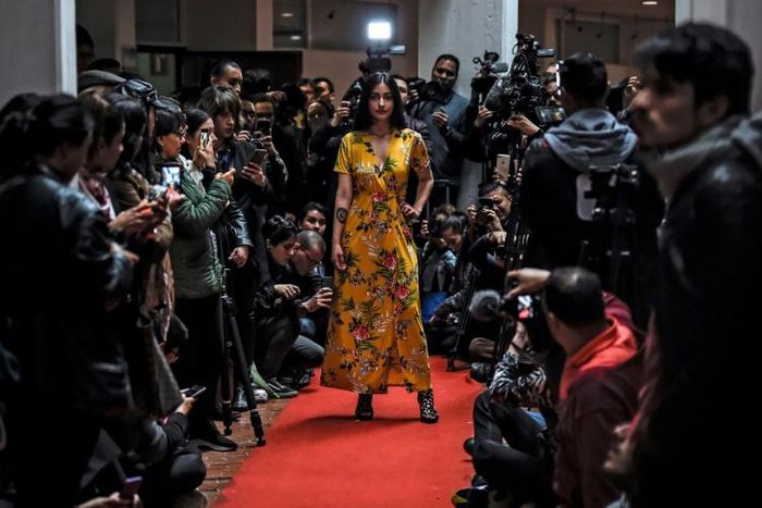 A model shows off a kimono during a fashion show by former FARC combatants in Bogota