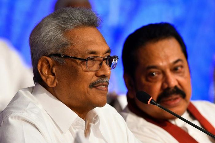 Sri Lankan presidential candidate Gotabhaya Rajapakse (left) with his brother, former president Mahinda Rajapakse during a press conference in Colombo