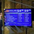 Currency exchange values are displayed on the buy-sell board in Buenos Aires, on August 13, 2019