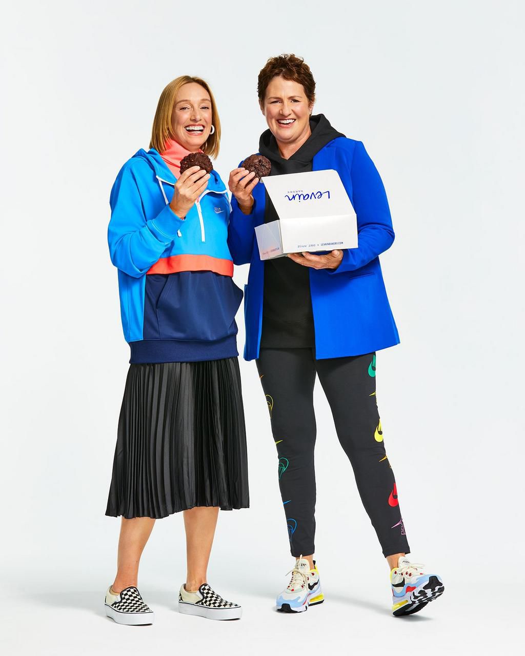 Pam Weekes (left) and Connie McDonald (right) take a bit of their dark chocolate cookies.