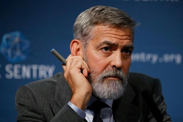 US actor George Clooney takes part in a press conference in central London to present a report on corruption in South Sudan