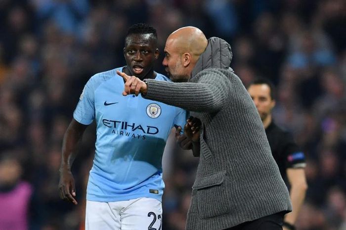 Manchester City manager Pep Guardiola gestures to Benjamin Mendy