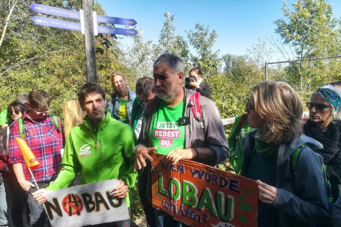Austrian environmentalist candidate Lukas Hammer (2nd L) has dismissed the idea of a highway under a national park as a 'solution of the past'